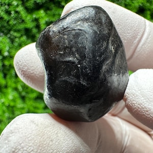 May include: A set of three ceramic mugs with a speckled, matte finish. The mugs are in shades of cream, light gray, and dark gray. Each mug has a simple, minimalist design, perfect for coffee or tea.