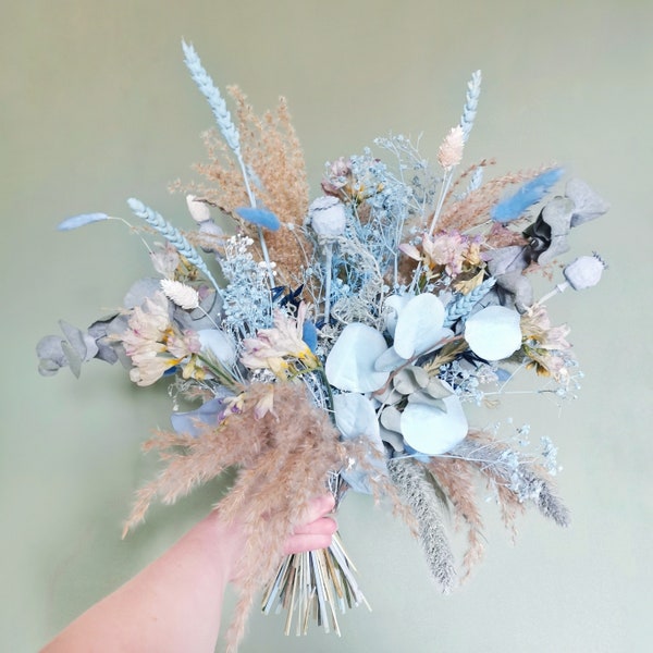 Dried flowers and silk eucalyptus bouquet in pale blue