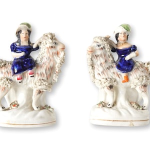 Antique Staffordshire Children on Goats