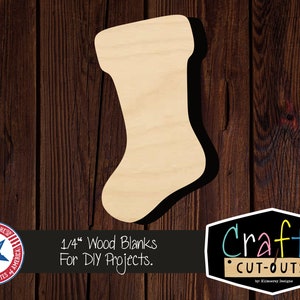 May include: A plain, unfinished wooden stocking shape, 1/4 inch thick, for DIY projects. The stocking is on a brown wood background. The text "1/4" Wood Blanks For DIY Projects." is below the stocking. The text "Crafty CUT-OUTS" is in the lower right corner of the image.