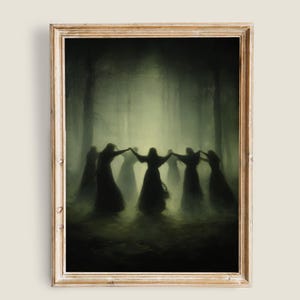 May include: A framed print depicts a circle of figures in long, dark robes, holding hands in a misty forest. The artwork has a muted color palette of greens and blacks, creating a mysterious and ethereal atmosphere.