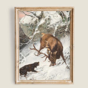 Puede incluir: Impresión enmarcada de época de un ciervo en una escena de bosque nevado. El ciervo tiene grandes astas y está mirando hacia abajo, con un perro negro delante. La obra de arte está en un marco dorado.