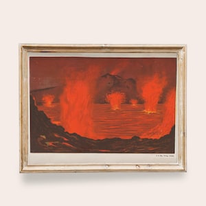 May include: Vintage framed print depicting a volcanic eruption over water. The artwork features vibrant orange and red hues, with the fiery eruption dominating the scene. The frame is a light, distressed wood.