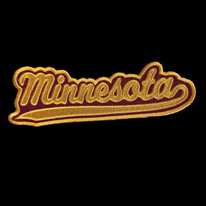 May include: Embroidered patch with the word "Minnesota" in a script font. The text is gold with a maroon outline and sits on a maroon background. The patch has a gold border and is set against a black background.