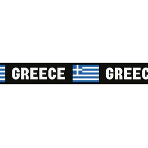 May include: Black luggage strap with a white buckle and the word "GREECE" printed in white on a black background. The strap has two Greek flags printed on it.