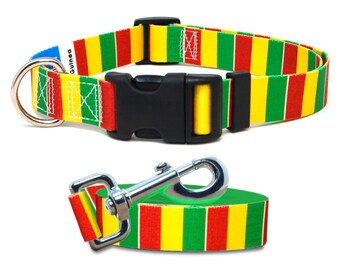 May include: A red, yellow, and green striped dog collar and leash set with a black buckle and silver D-ring. The collar has the word "Guinea" printed on it.