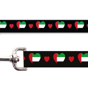 May include: Black dog leash with a repeating pattern of red hearts and hearts with the flag of the United Arab Emirates.