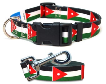 May include: A black and green dog collar and leash with the flag of Jordan printed on them. The collar has a black plastic buckle and a silver D-ring. The leash has a silver clip.