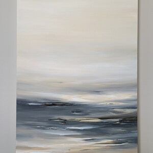 May include: Abstract painting of a seascape with a light brown sandy beach, a dark blue ocean, and a light blue sky with white clouds.