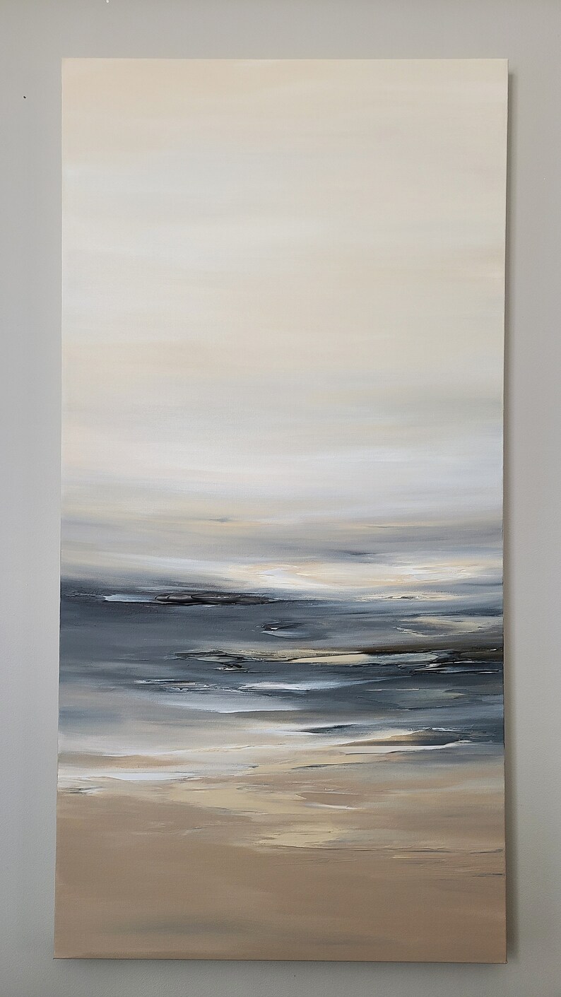 May include: Abstract painting of a seascape with a light brown sandy beach, a dark blue ocean, and a light blue sky with white clouds.