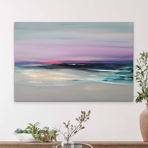 May include: Abstract painting of a seascape with a pink and purple sky, a dark blue ocean, and a white sandy beach.