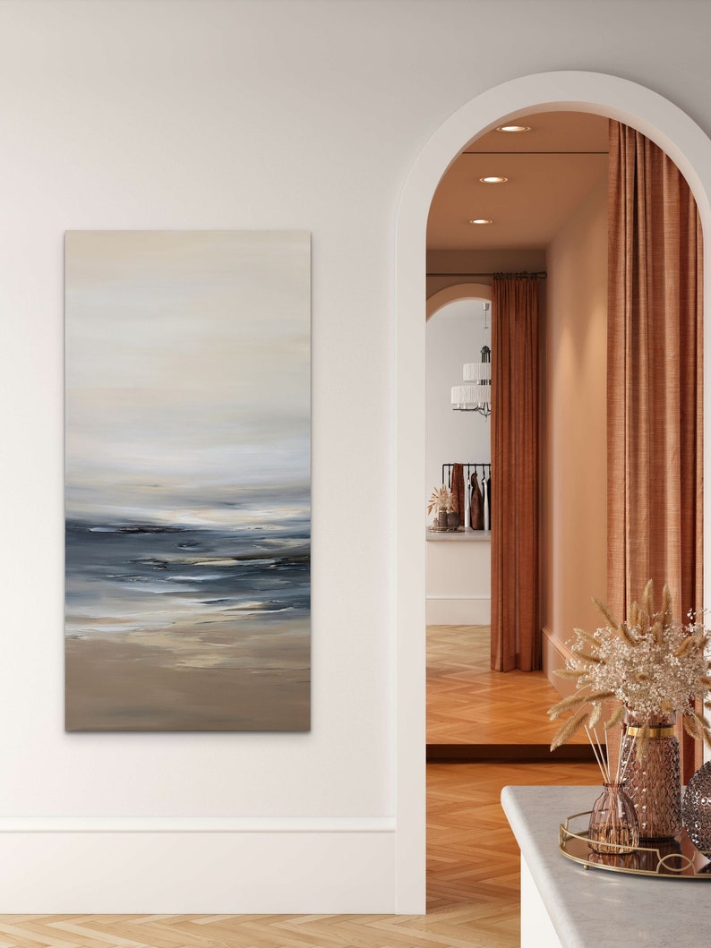 May include: A painting of a seascape with a light blue sky, white clouds, and a dark blue ocean with white waves. The painting is in a modern style and has a calming effect.