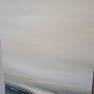 May include: Abstract painting with a horizontal composition. The painting features a gradient of light blue, beige, and white colors, creating a sense of depth and movement. The bottom of the painting features a darker blue color, suggesting a horizon line.