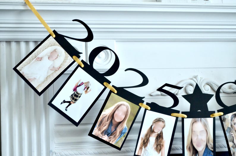 May include: Black and gold graduation banner with photos and the numbers 2023. The banner is strung with gold clips and has a star in the middle.