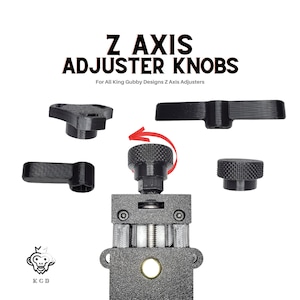 May include: A set of four black plastic knobs for adjusting the Z-axis on a 3D printer. The knobs are designed to fit King Gubby Designs Z-axis adjusters. The knobs are shown in various positions, including a close-up of the knob being turned.