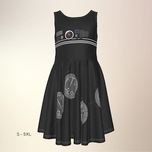 May include: Black sleeveless dress with a graphic design. The dress features a design of gray and white shapes across the bodice and skirt. The dress is available in sizes S-5XL.
