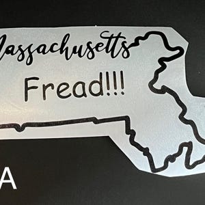 May include: A white decal in the shape of the state of Massachusetts with the words "Massachusetts Fread!!!" in black script. The decal has a black border and the letter "A" in white in the lower left corner.