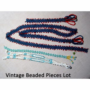 May include: A lot of vintage beaded pieces, including a long strand of blue and red beads and two shorter strands of white and turquoise beads.