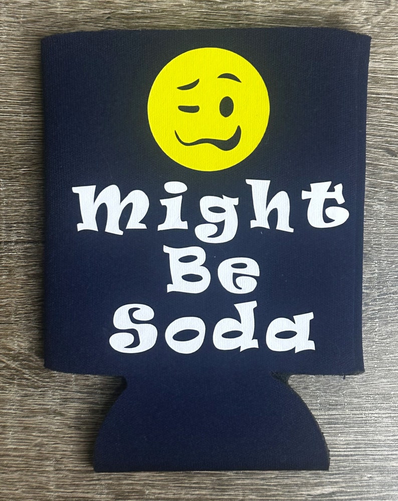 Pode incluir: Um refrigerador de latas azul com um rosto sorridente branco piscando e o texto "might be soda".