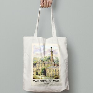 May include: A white canvas tote bag with a colorful illustration of a historic mill building. The text "MARLBOROUGH MILLS MILTON" is printed on the bag.