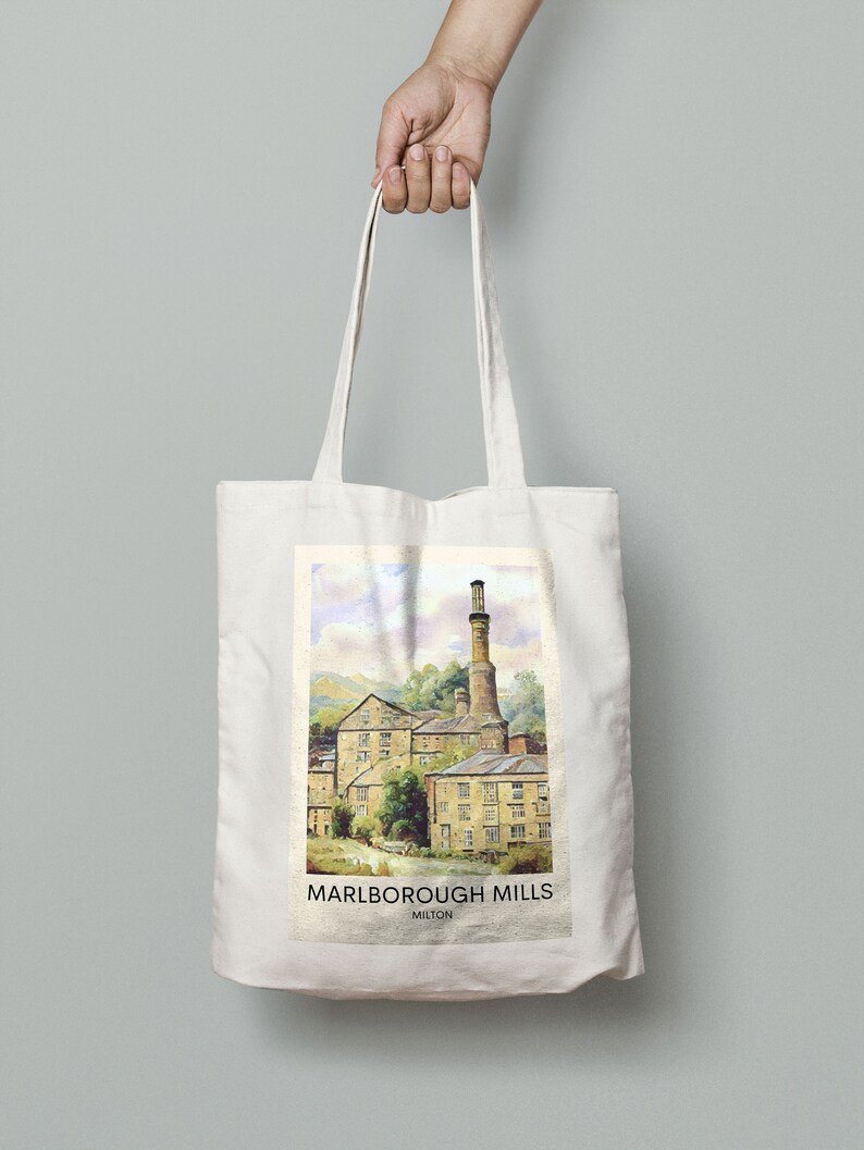 May include: A white canvas tote bag with a colorful illustration of a historic mill building. The text "MARLBOROUGH MILLS MILTON" is printed on the bag.