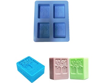 May include: A blue silicone mold with four rectangular cavities, each featuring a raised design of a tree with leaves. The mold is for making soap bars.