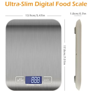 May include: An ultra-slim digital food scale with a brushed metal surface. The scale measures 5.47 inches wide, 7.01 inches long, and 0.7 inches thick. It has a digital display and buttons for power, tare, and unit selection. The maximum capacity is 5000g.