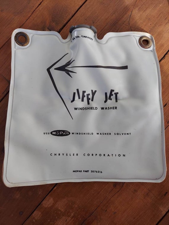 Windshield washer fluid bag with cap, electric fluid pump, grommet