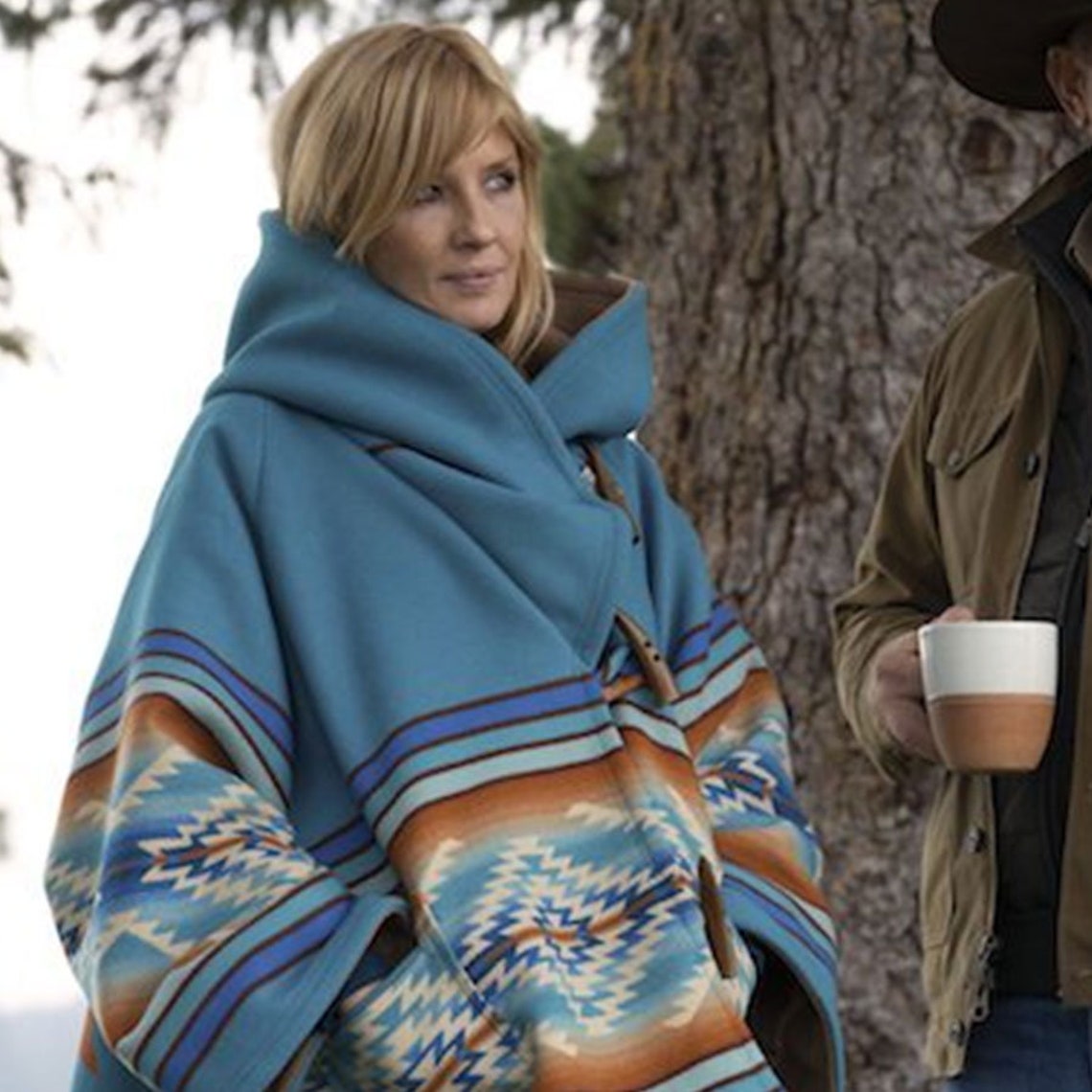 beth's blue poncho on yellowstone