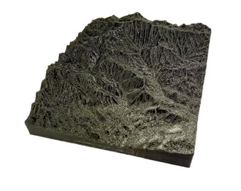 May include: A 3D printed model of a mountain range, with a dark gray color and a textured surface.