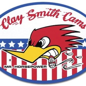 May include: Oval sticker featuring the Clay Smith Cams logo. The design includes a red cartoon bird with a yellow beak, the text "Clay Smith Cams" in red script, and the words "MR. HORSEPOWER". The background has a red and white striped pattern.