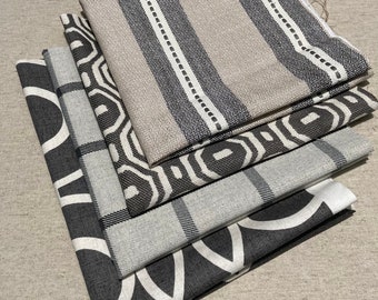 A bundle of lovely charcoal and linen coloured Clarke and Clarke fabrics