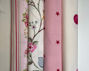 A bundle of pretty pink printed cottons