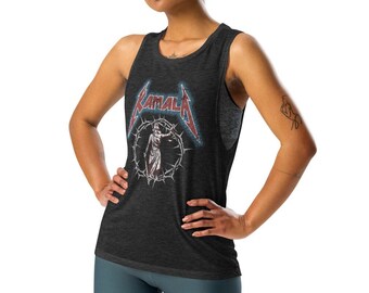 May include: A woman wearing a black tank top with a Metallica logo and dark blue biker shorts. She is standing with her hands on her hips and looking at the camera.