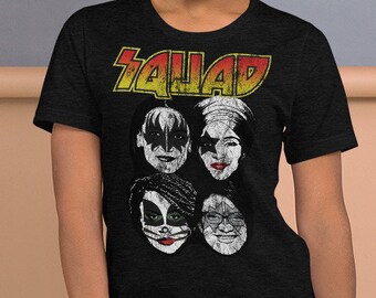 May include: A black t-shirt with a faded graphic of the band "KISS" with the word "Squad" above the band members' faces.