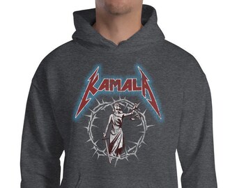 May include: A dark grey hooded sweatshirt with a red and white graphic of a figure holding scales of justice in a crown of thorns. The graphic is surrounded by a red and white text that reads "KAMALA".