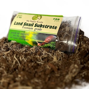 May include: A transparent bag containing land snail substrate, labelled "My Happy Snails." The label states "Land Snail Substrate Premium grade" and "200 grams." The substrate is a mix of brown soil and dried plant matter.