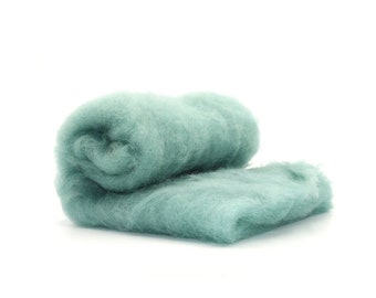 May include: A roll of teal blue wool roving, a type of fiber used for felting and spinning.
