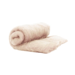 May include: A soft, light brown, rolled up blanket made of wool.