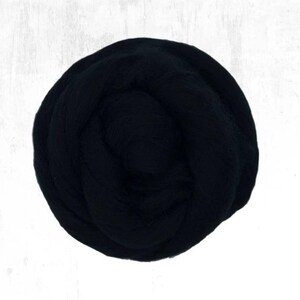 May include: A ball of black wool yarn, ideal for knitting or crocheting.