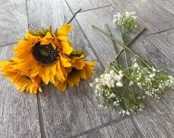 Individual sunflowers and baby’s breath for centerpieces and/or cake