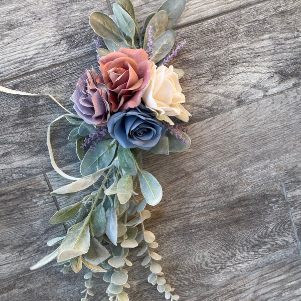 Purple,mauve, light blue, ivory roses and greenery aisle marker