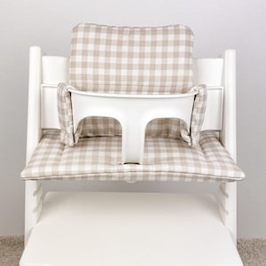 coated cushion material for Stokke Tripp Trapp high chair, showing smooth wipeable surface and soft padding for comfortable seating.