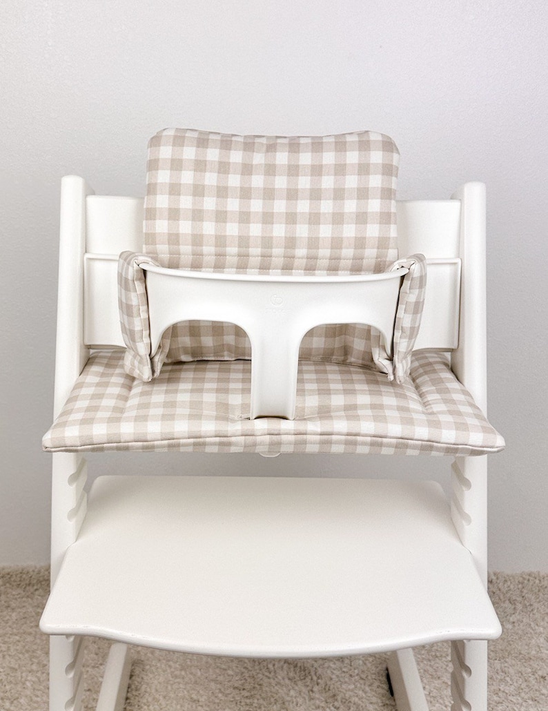coated cushion material for Stokke Tripp Trapp high chair, showing smooth wipeable surface and soft padding for comfortable seating.