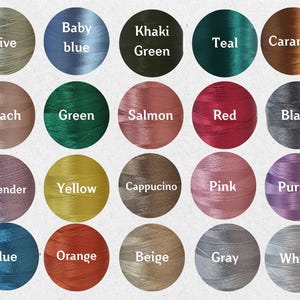 May include: A color chart featuring 20 thread colors, each labeled with its name. Colors include olive, baby blue, khaki green, teal, caramel, peach, green, salmon, red, black, lavender, yellow, cappuccino, pink, purple, blue, orange, beige, gray, and white.