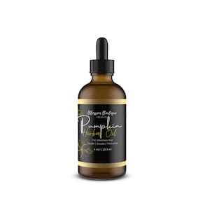 May include: A brown glass bottle of Blossom Boutique Pumpkin Herbal Oil with a black dropper. The label features gold script and the text "Pumpkin Herbal Oil" and "For Maximum Hair Health | Growth | Thickness". The bottle contains 4 fl oz / 118.3 ml.