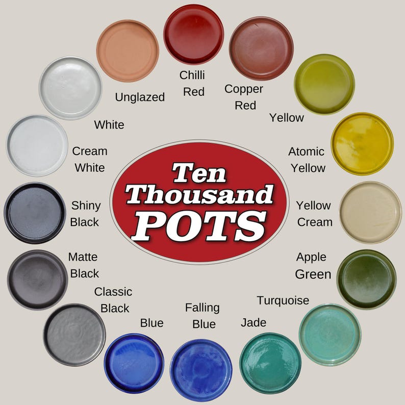 May include: A selection of ceramic pots in a circular display, showcasing a range of colours such as white, black, red, yellow, and blue. Each pot is labelled with its colour. The central logo reads "Ten Thousand POTS".