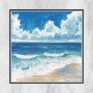 May include: A framed artwork showing a coastal scene. The image features a bright blue sky with fluffy white clouds above a deep blue ocean. Waves crash onto a sandy beach, creating a serene and picturesque landscape.