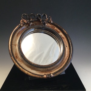 Vintage earthenware pottery hanging mirror