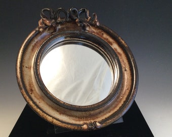 Vintage earthenware pottery hanging mirror